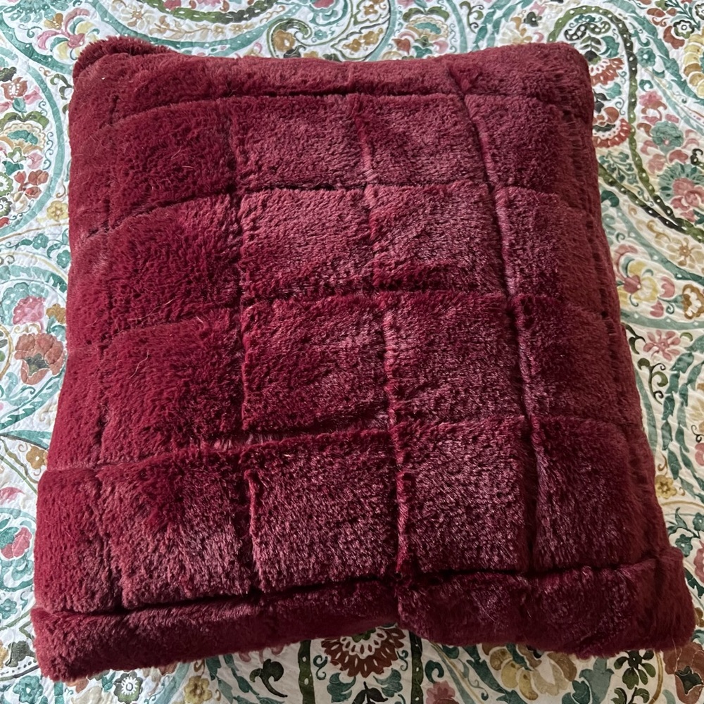 Decorative throw pillow (used on bed)